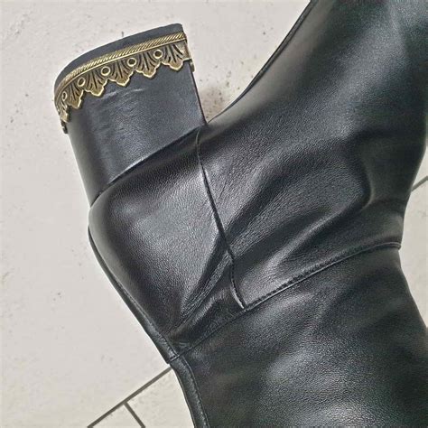 chanel black leather thigh high boots|knee high Chanel boots.